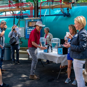 A group of people testing drinking water